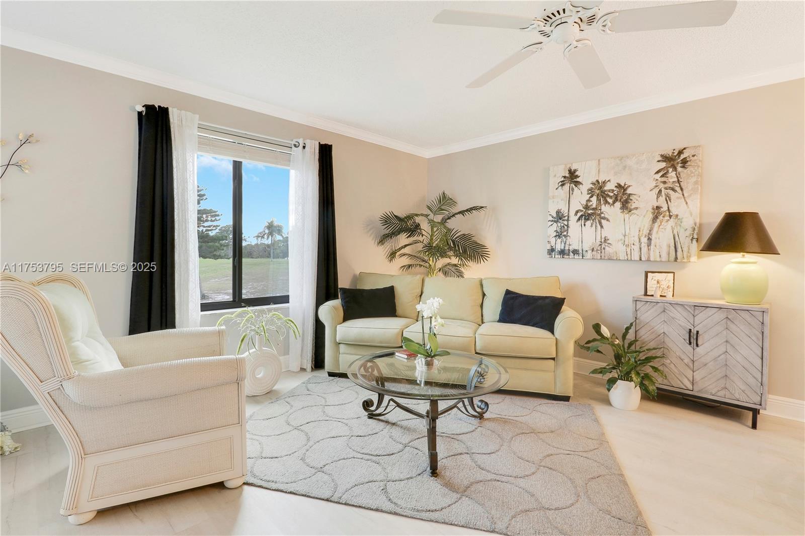 5313 Southeast Miles Grant Road, Unit 206 Stuart, FL 34997 - Photo 11 of 39 a living room with furniture and white walls