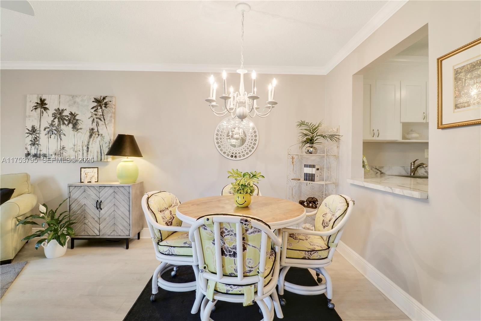 5313 Southeast Miles Grant Road, Unit 206 Stuart, FL 34997 - Photo 14 of 39 a dining room with furniture a rug and wooden floor
