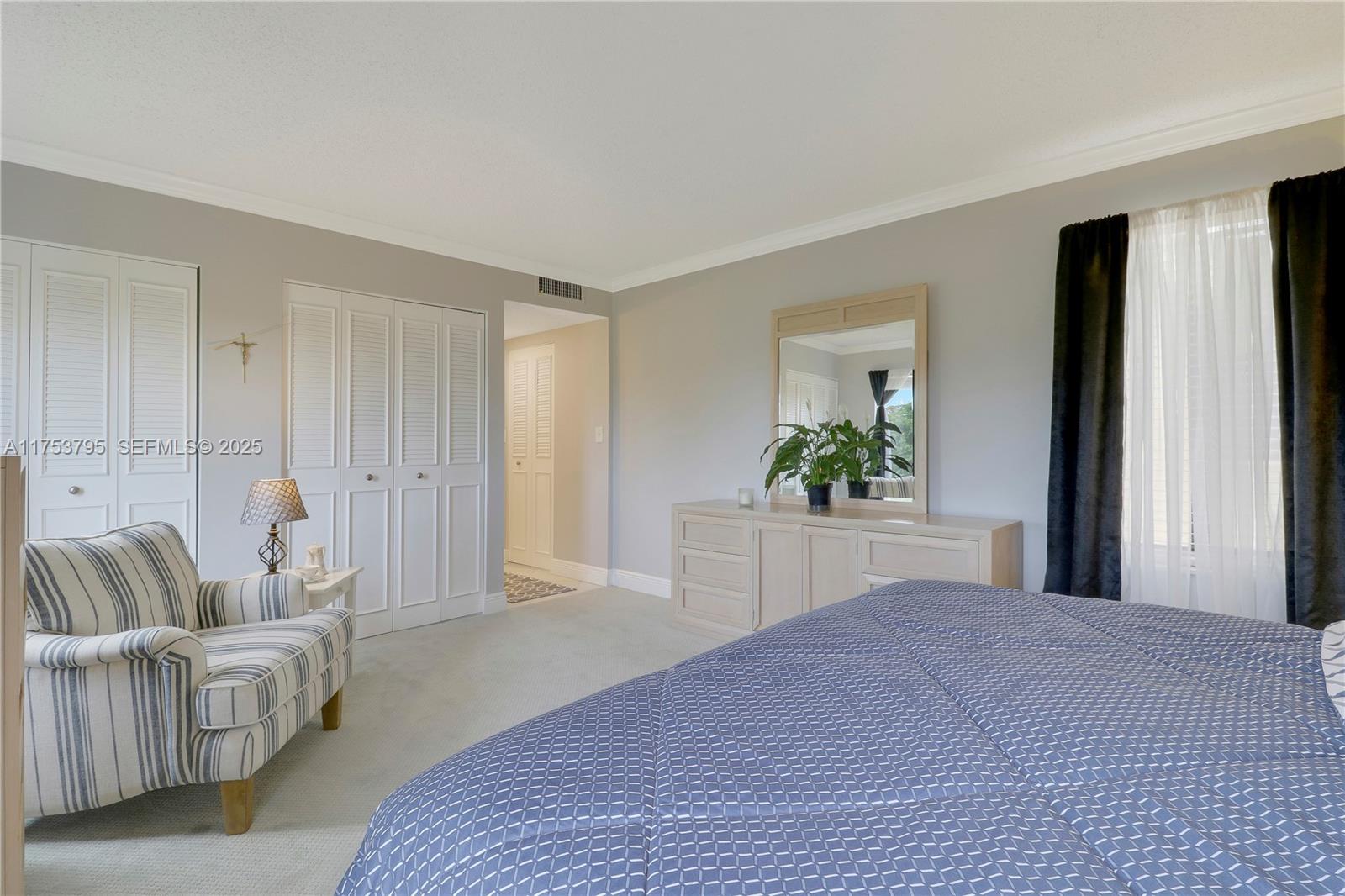 5313 Southeast Miles Grant Road, Unit 206 Stuart, FL 34997 - Photo 17 of 39 a bedroom with a bed and a couch