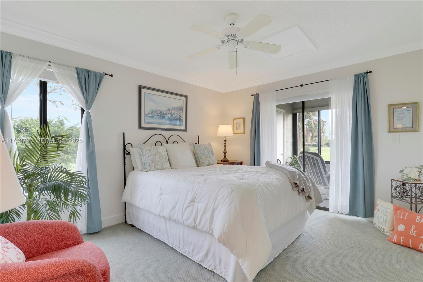 5313 Southeast Miles Grant Road, Unit 206 Stuart, FL 34997 - Photo 20 of 39 a spacious bedroom with a bed and a couch