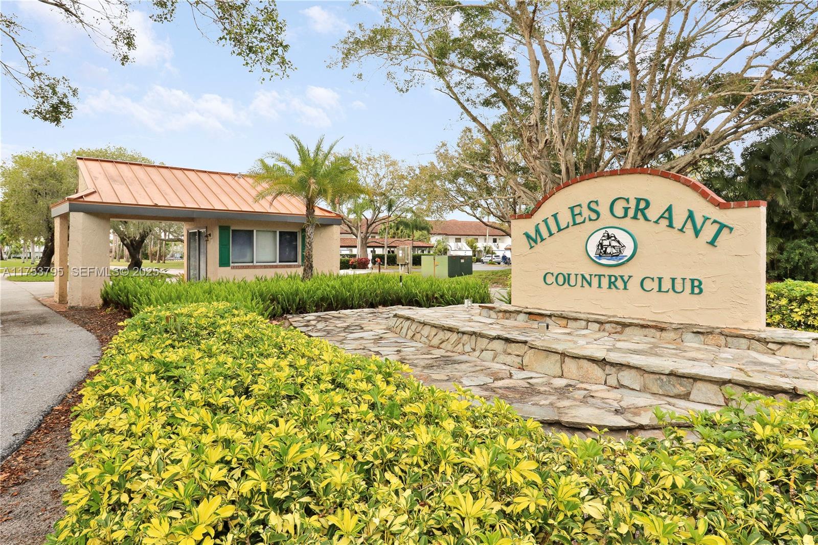 5313 Southeast Miles Grant Road, Unit 206 Stuart, FL 34997 - Photo 2 of 39 a sign on the side of the road