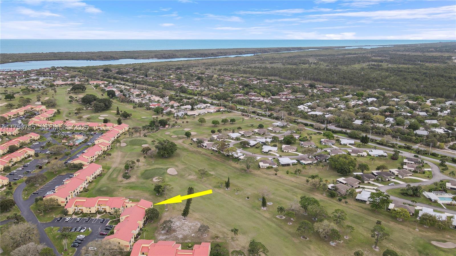 5313 Southeast Miles Grant Road, Unit 206 Stuart, FL 34997 - Photo 33 of 39 an aerial view of residential houses with outdoor space