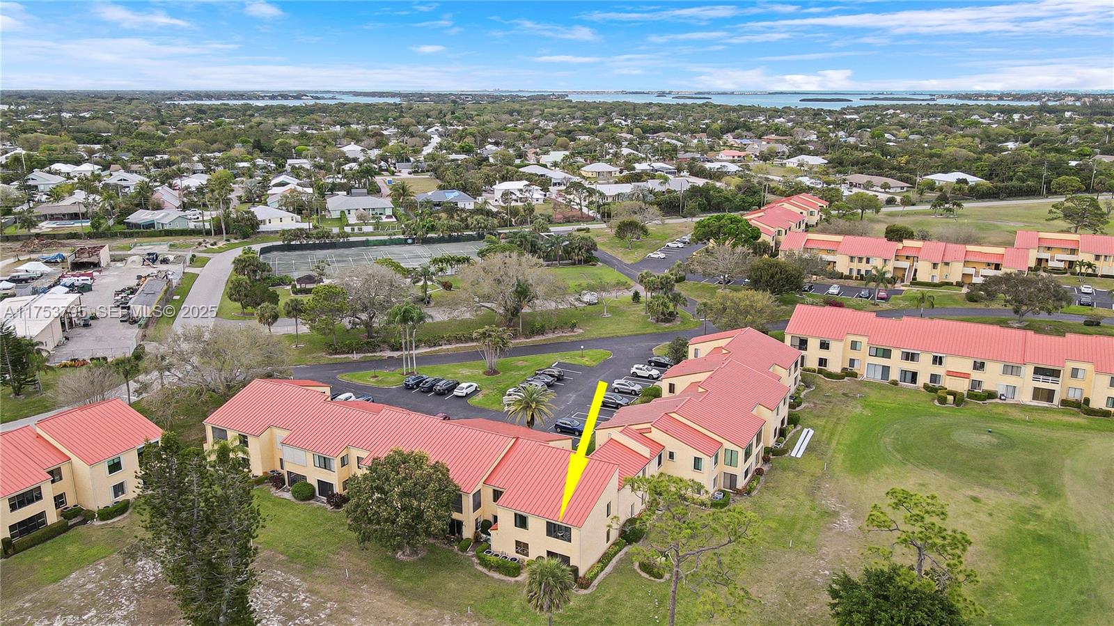 5313 Southeast Miles Grant Road, Unit 206 Stuart, FL 34997 - Photo 34 of 39 an aerial view of residential houses with outdoor space