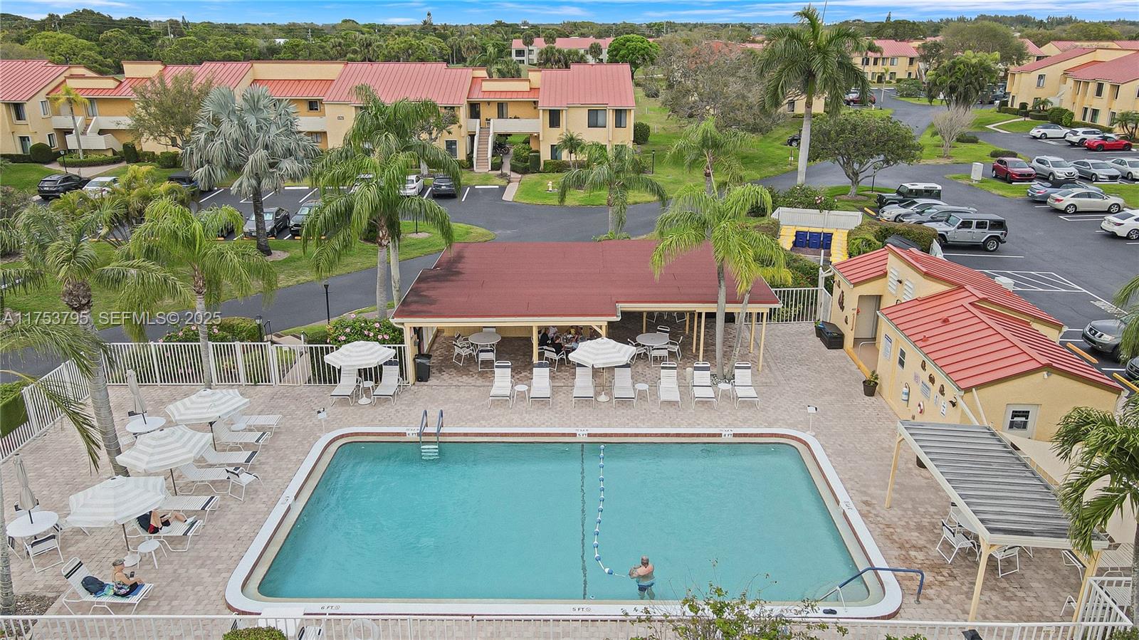 5313 Southeast Miles Grant Road, Unit 206 Stuart, FL 34997 - Photo 38 of 39 an aerial view of a house with outdoor space patio and swimming pool