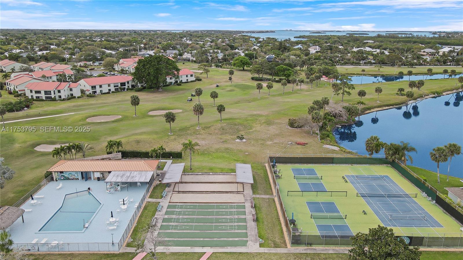 5313 Southeast Miles Grant Road, Unit 206 Stuart, FL 34997 - Photo 39 of 39 an aerial view of a house with a garden