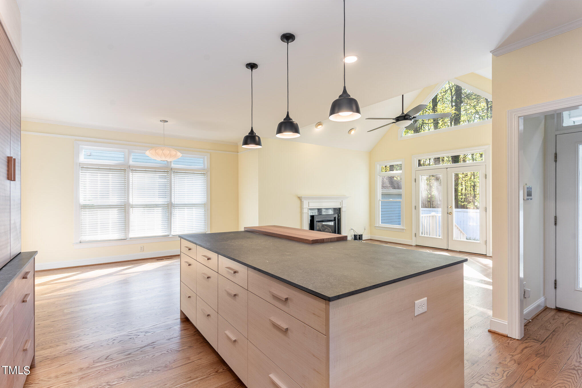 209 Stable Road Carrboro, NC 27510 - Photo 12 of 33 a view of a kitchen island a sink and wooden floor