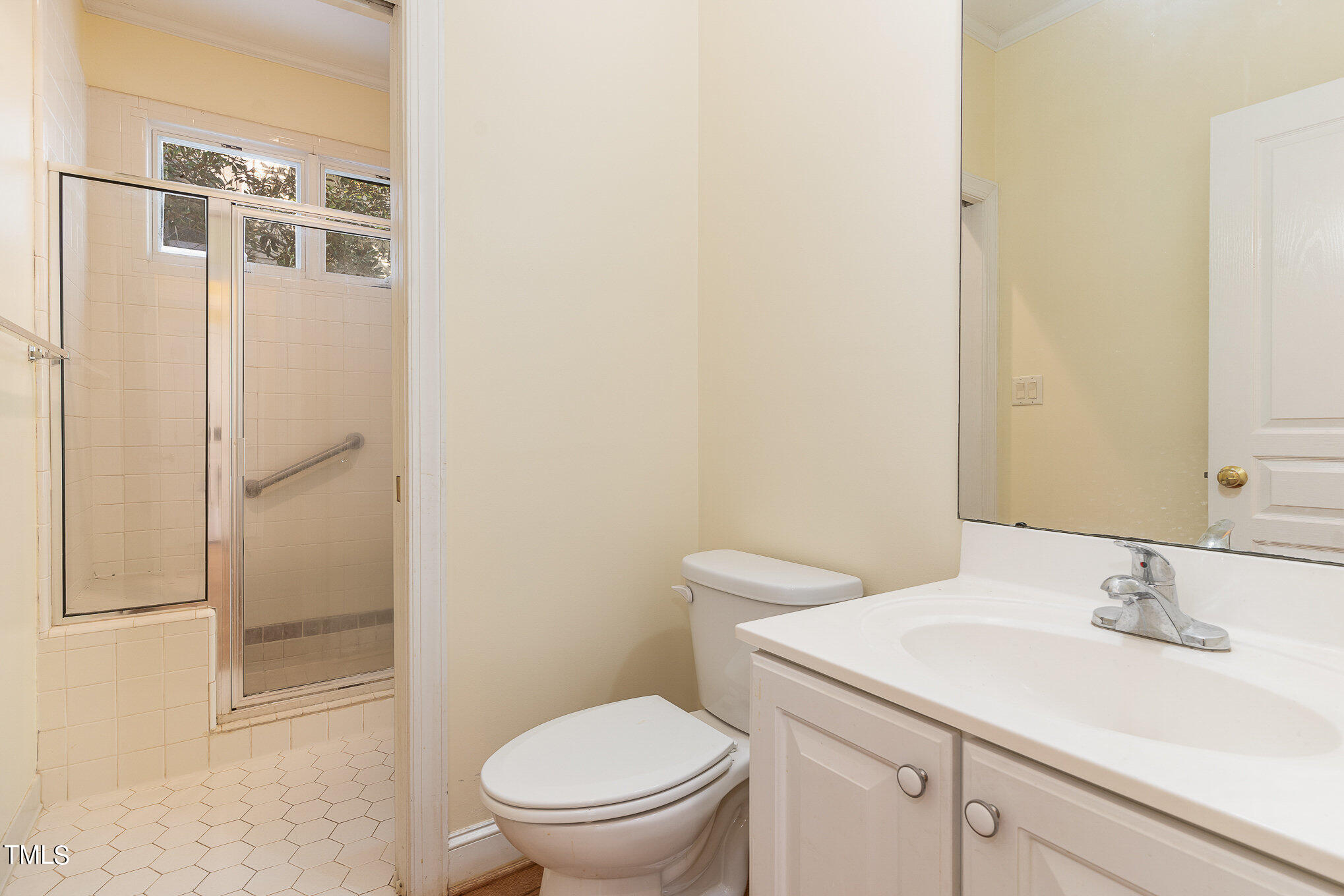 209 Stable Road Carrboro, NC 27510 - Photo 17 of 33 a bathroom with a sink a toilet and shower