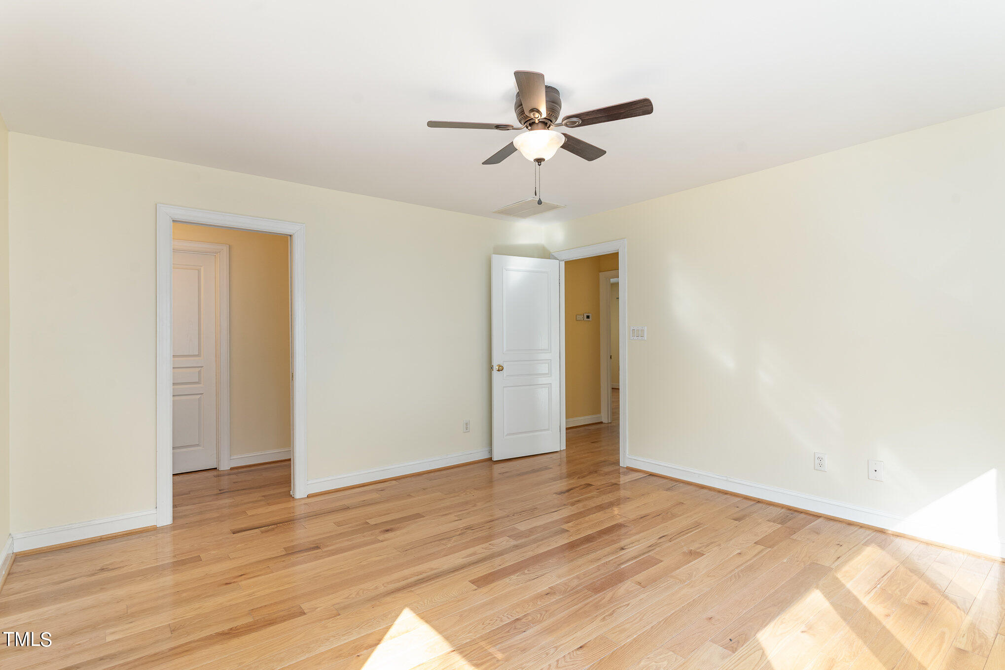 209 Stable Road Carrboro, NC 27510 - Photo 19 of 33 a view of room with wooden floor and ceiling fan