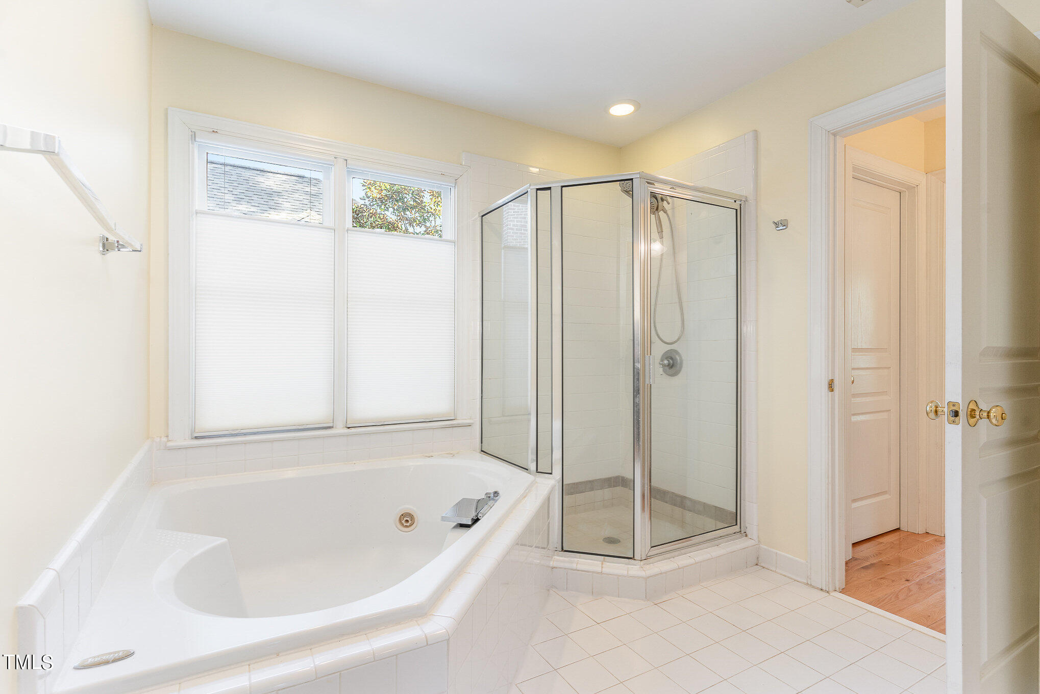 209 Stable Road Carrboro, NC 27510 - Photo 23 of 33 a bathroom with a bathtub and a shower