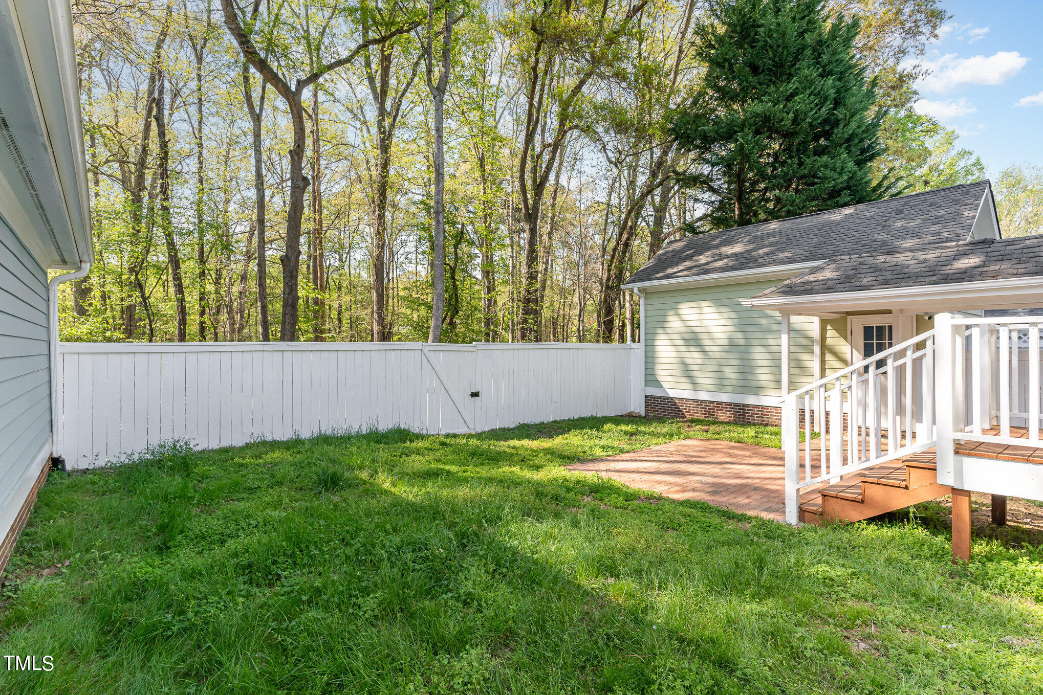 209 Stable Road Carrboro, NC 27510 - Photo 27 of 33 a view of a backyard with plants and large trees