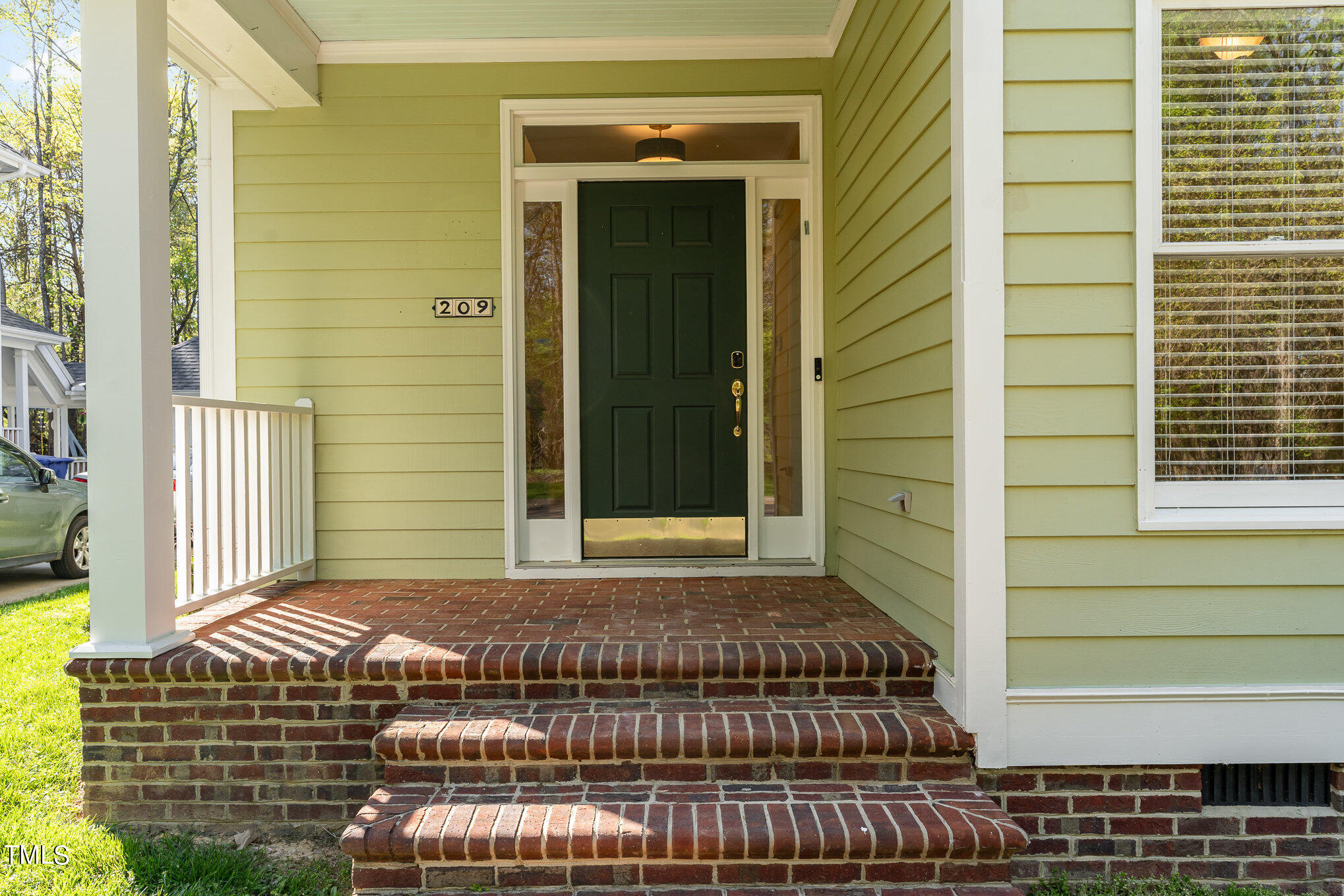 209 Stable Road Carrboro, NC 27510 - Photo 3 of 33 a front view of a house with a yard