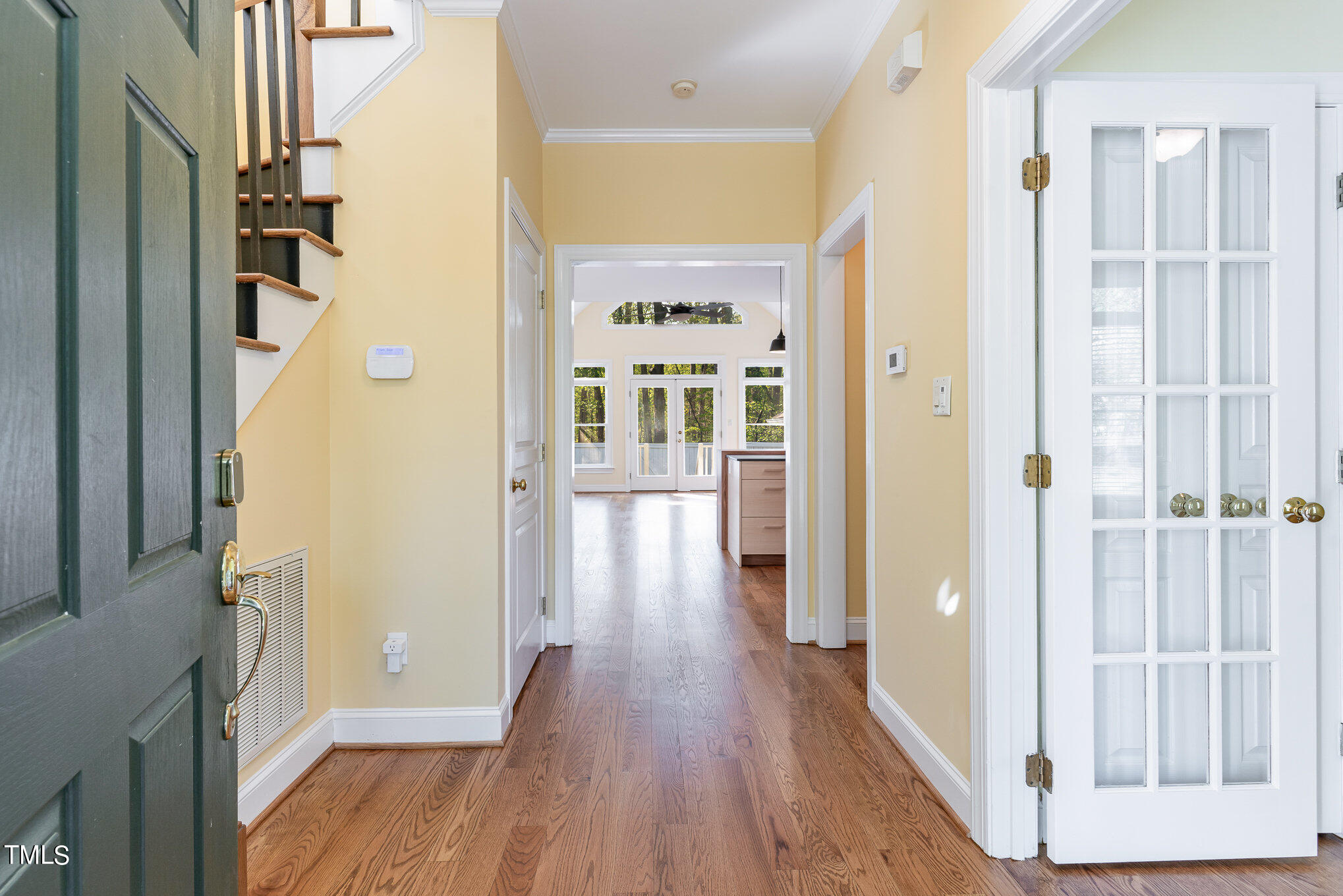 209 Stable Road Carrboro, NC 27510 - Photo 4 of 33 a view of a hallway with wooden floor and entryway