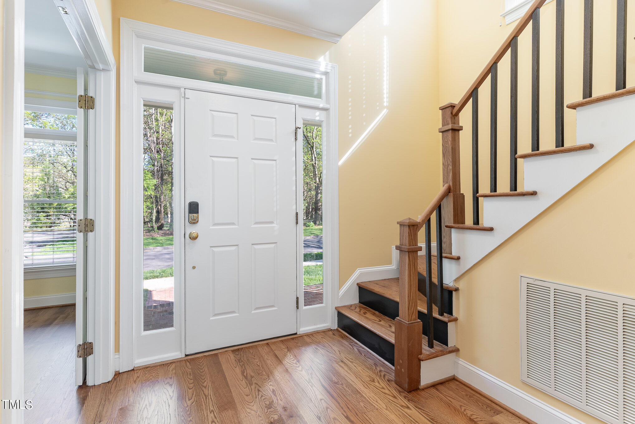 209 Stable Road Carrboro, NC 27510 - Photo 5 of 33 a view of an entryway with wooden floor and door