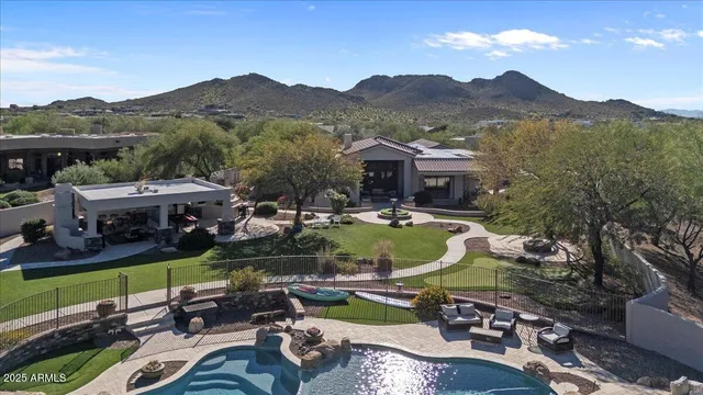 a living room with furniture a floor to ceiling window and a flat screen tv