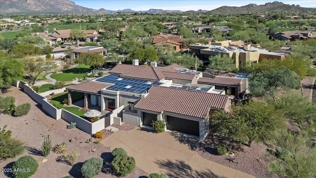 a kitchen with stainless steel appliances granite countertop a stove top oven a sink dishwasher and a refrigerator