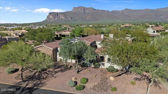 walk in closet with clothes and shoes