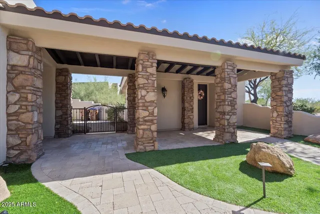 a bed room with a bed and a chandelier