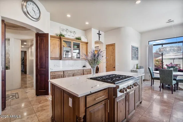 a front view of a house with a garden and plants