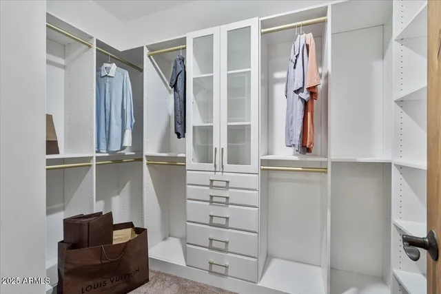 a living room with furniture tv and a flat screen tv