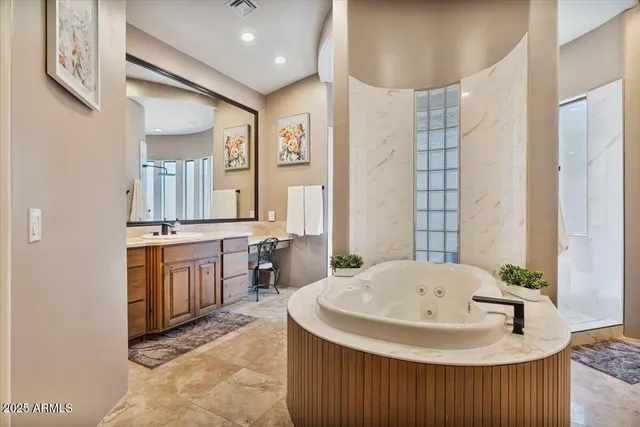 a view of a backyard with lawn chairs and a large tree