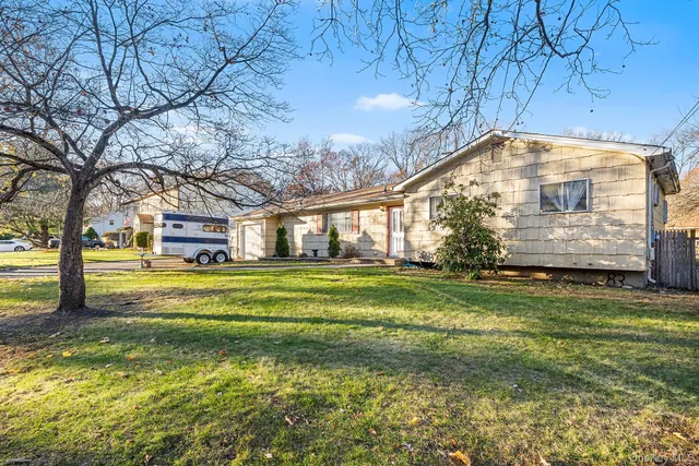 a front view of house with yard