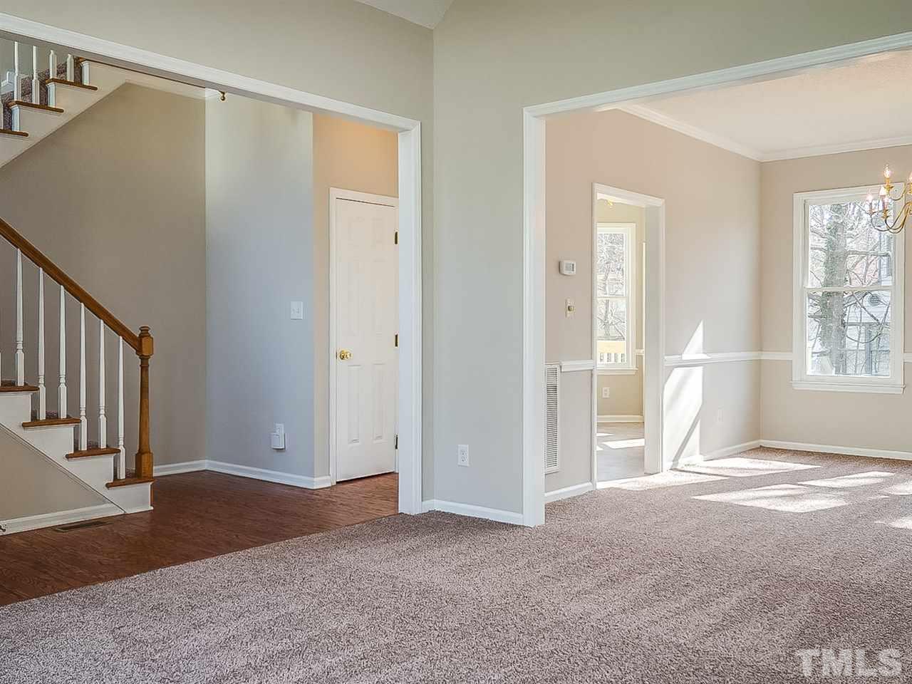2500 Holbrook Court Raleigh, NC 27604 - Photo 11 of 26 a view of an empty room with window and stairs