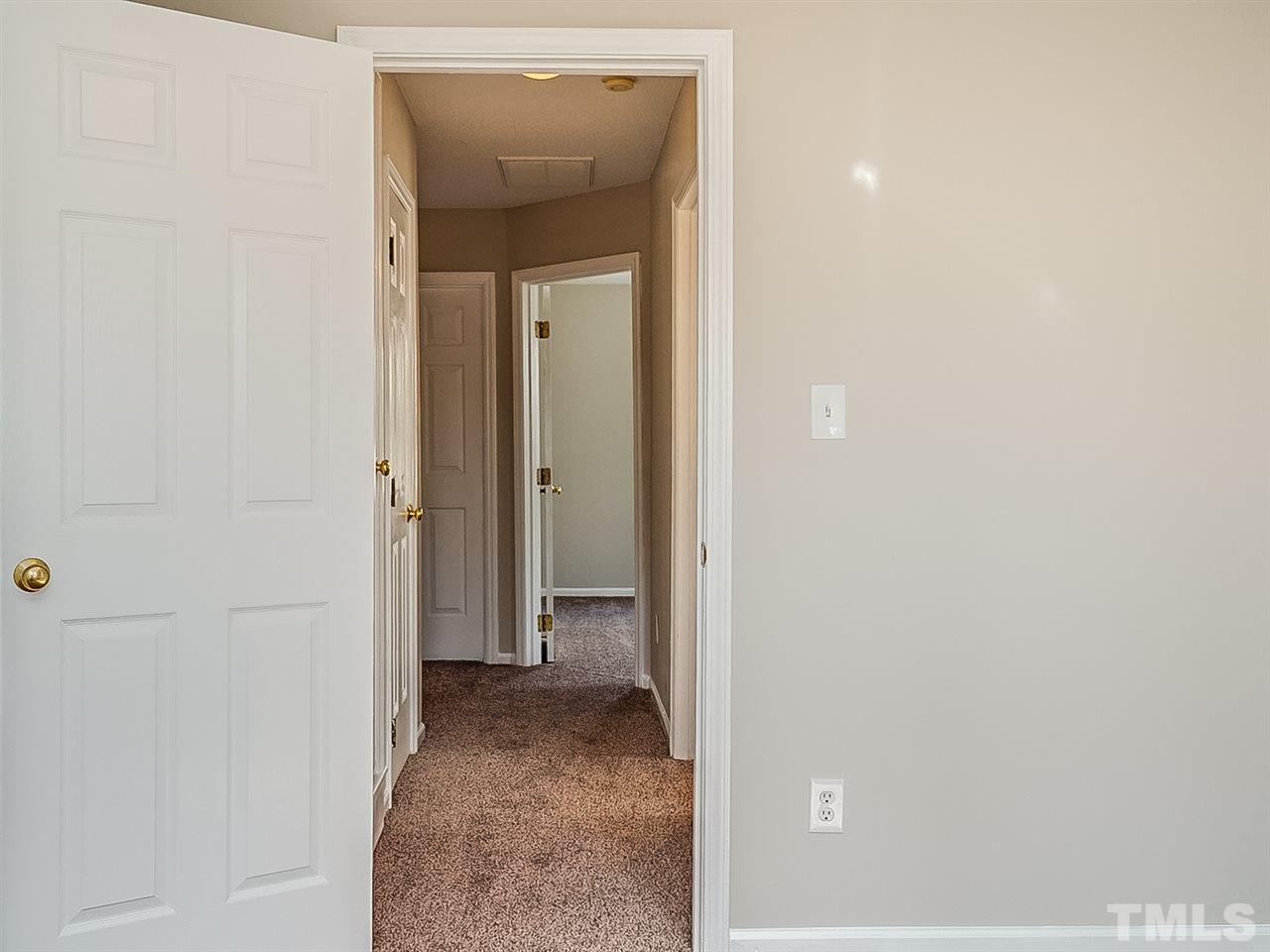 2500 Holbrook Court Raleigh, NC 27604 - Photo 22 of 26 a view of a livingroom from a hallway
