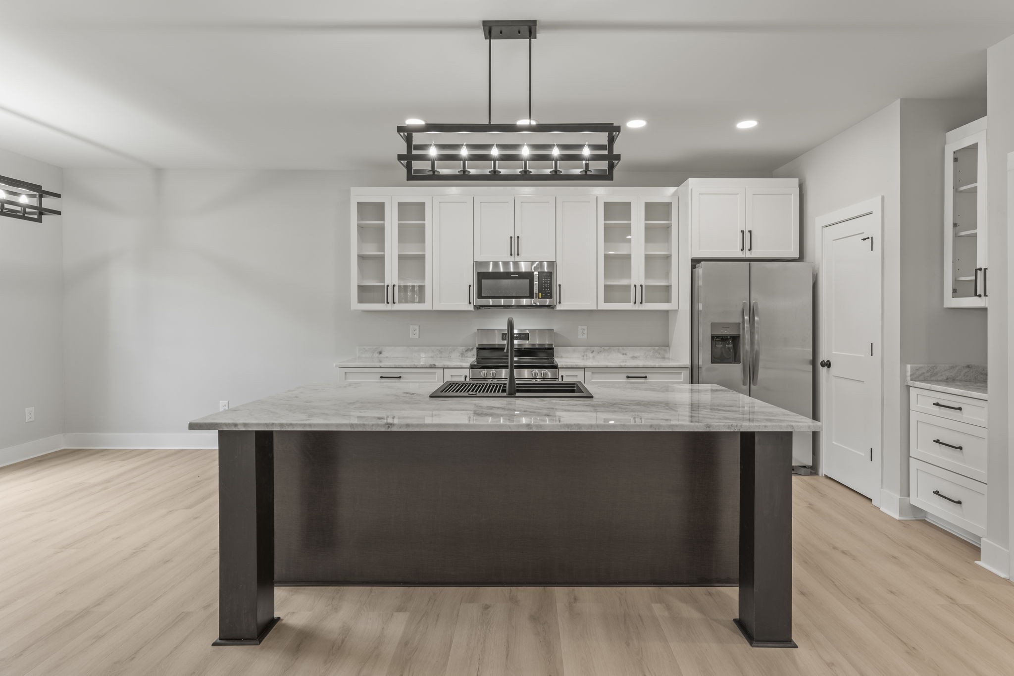 106 5th Avenue North Decherd, TN 37324 - Photo 13 of 50 a kitchen with stainless steel appliances a sink and a refrigerator