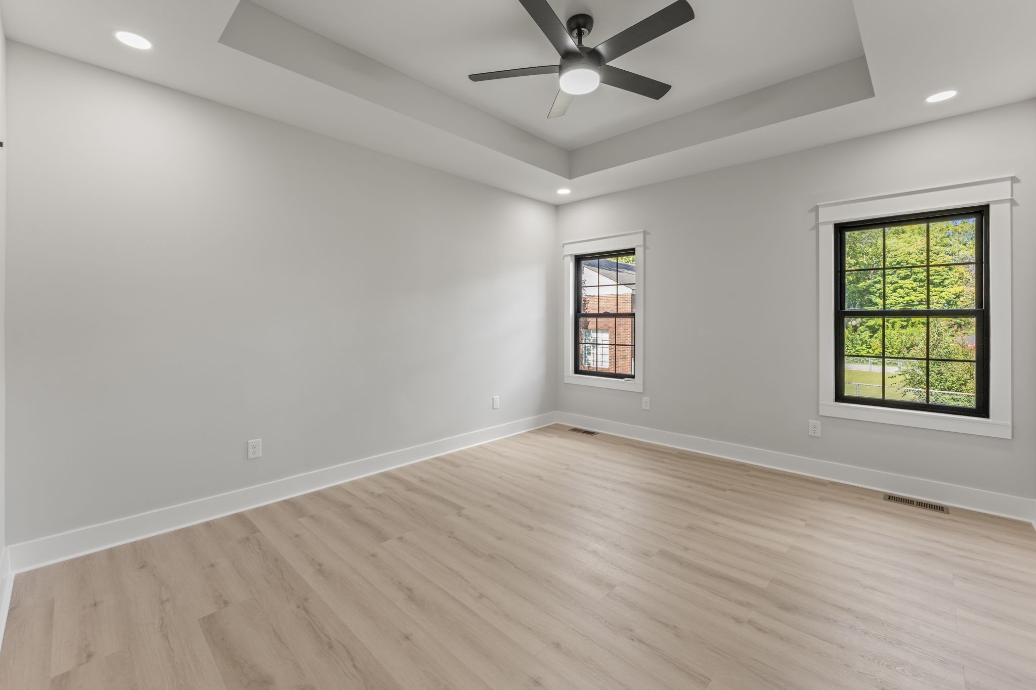 106 5th Avenue North Decherd, TN 37324 - Photo 17 of 50 a view of an empty room with a window and wooden floor