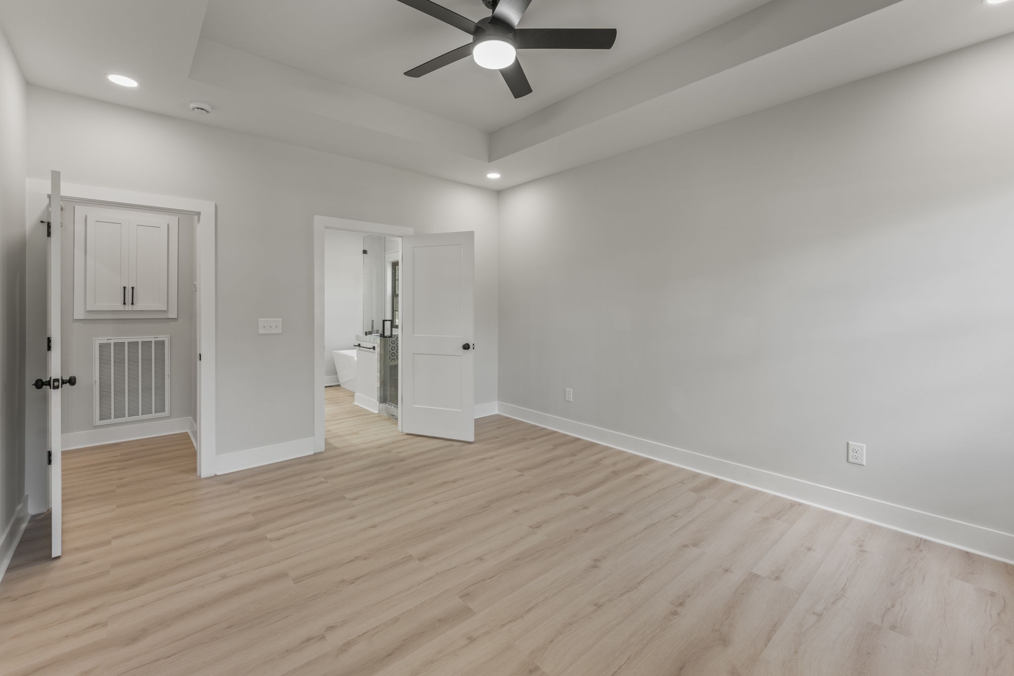 106 5th Avenue North Decherd, TN 37324 - Photo 18 of 50 an empty room with wooden floor and ceiling fan