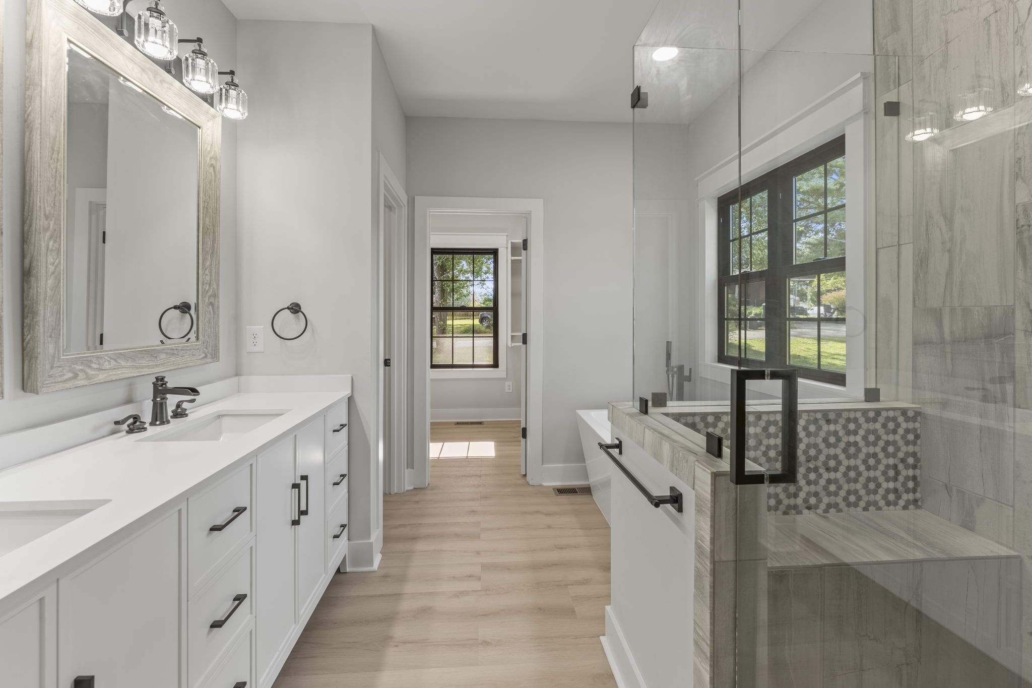 106 5th Avenue North Decherd, TN 37324 - Photo 19 of 50 a spacious bathroom with double vanity and mirrors
