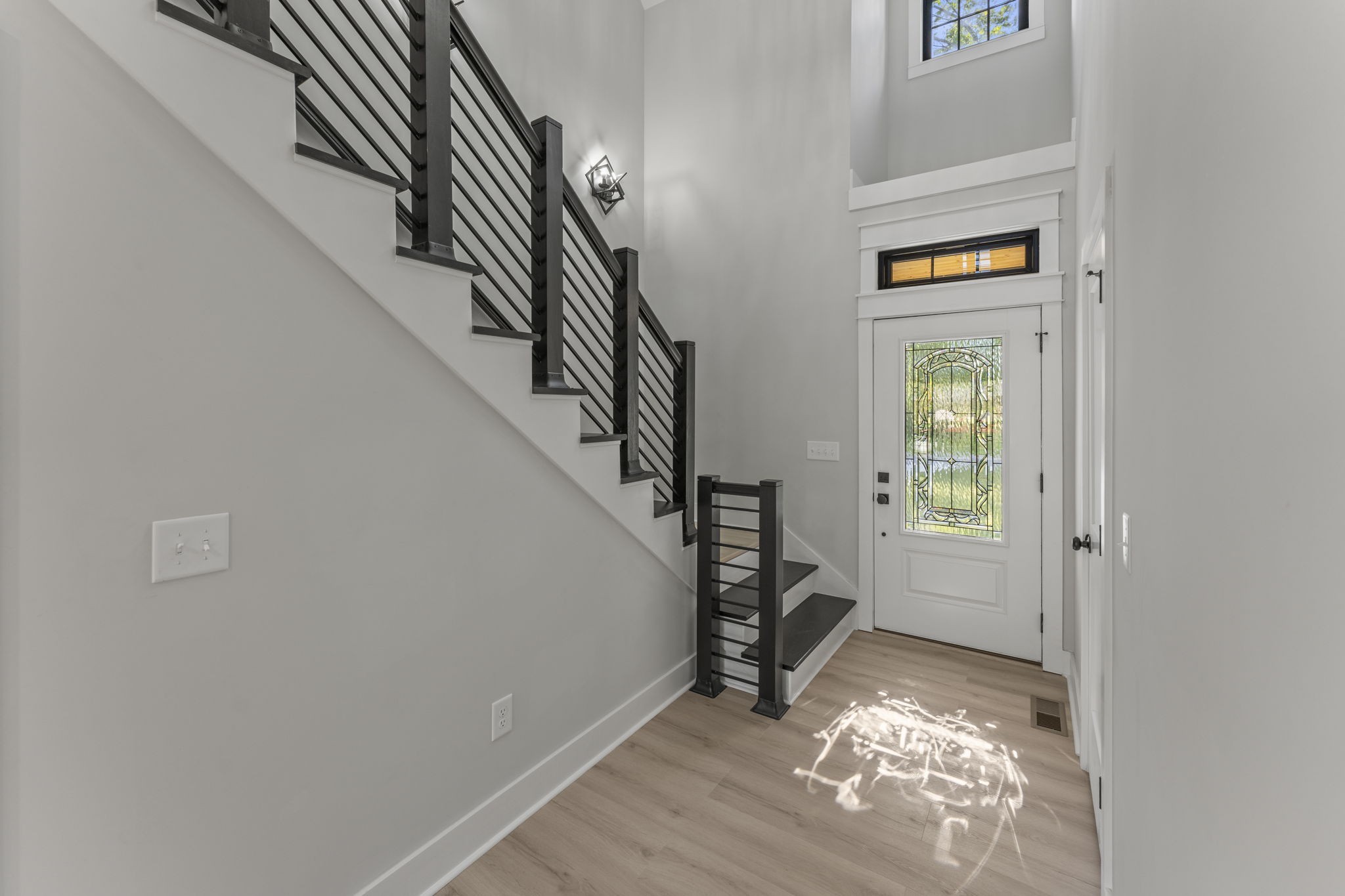 106 5th Avenue North Decherd, TN 37324 - Photo 28 of 50 a view of entryway and hall with wooden floor