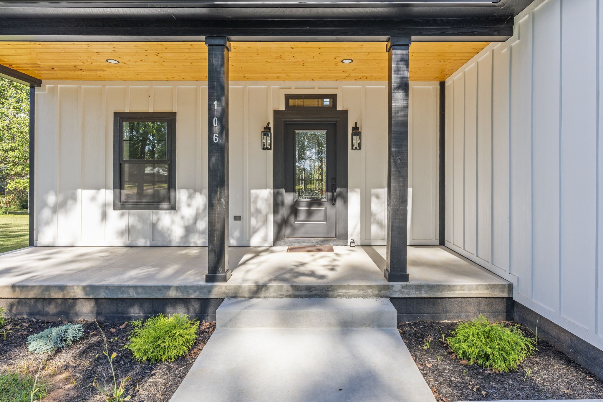 106 5th Avenue North Decherd, TN 37324 - Photo 3 of 50 a view of porch with a table and chairs