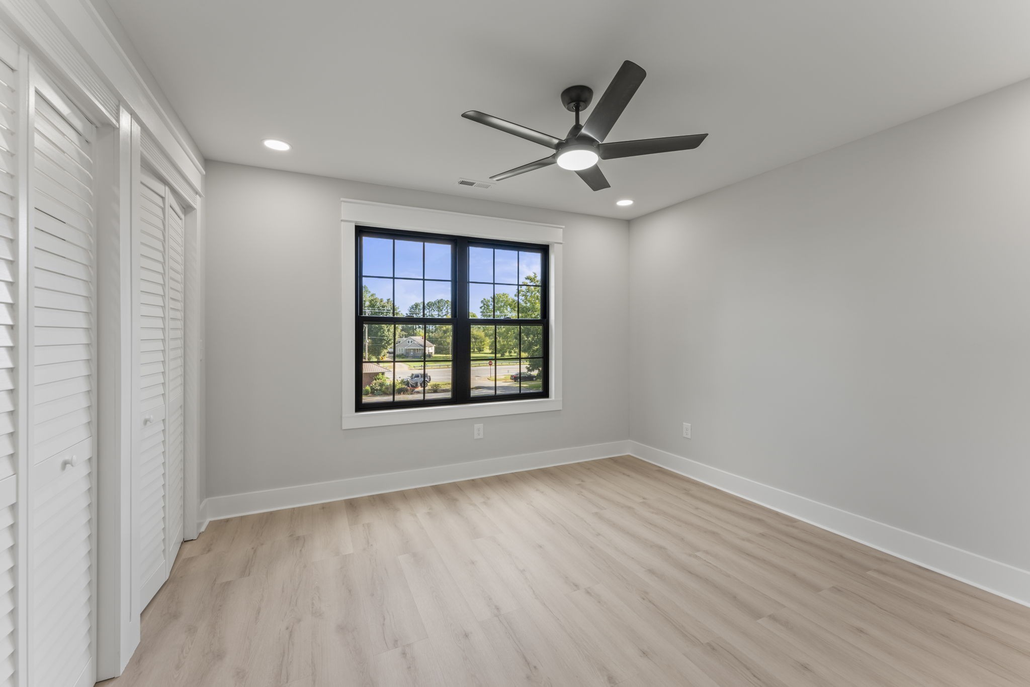 106 5th Avenue North Decherd, TN 37324 - Photo 39 of 50 wooden floor in an empty room with a window