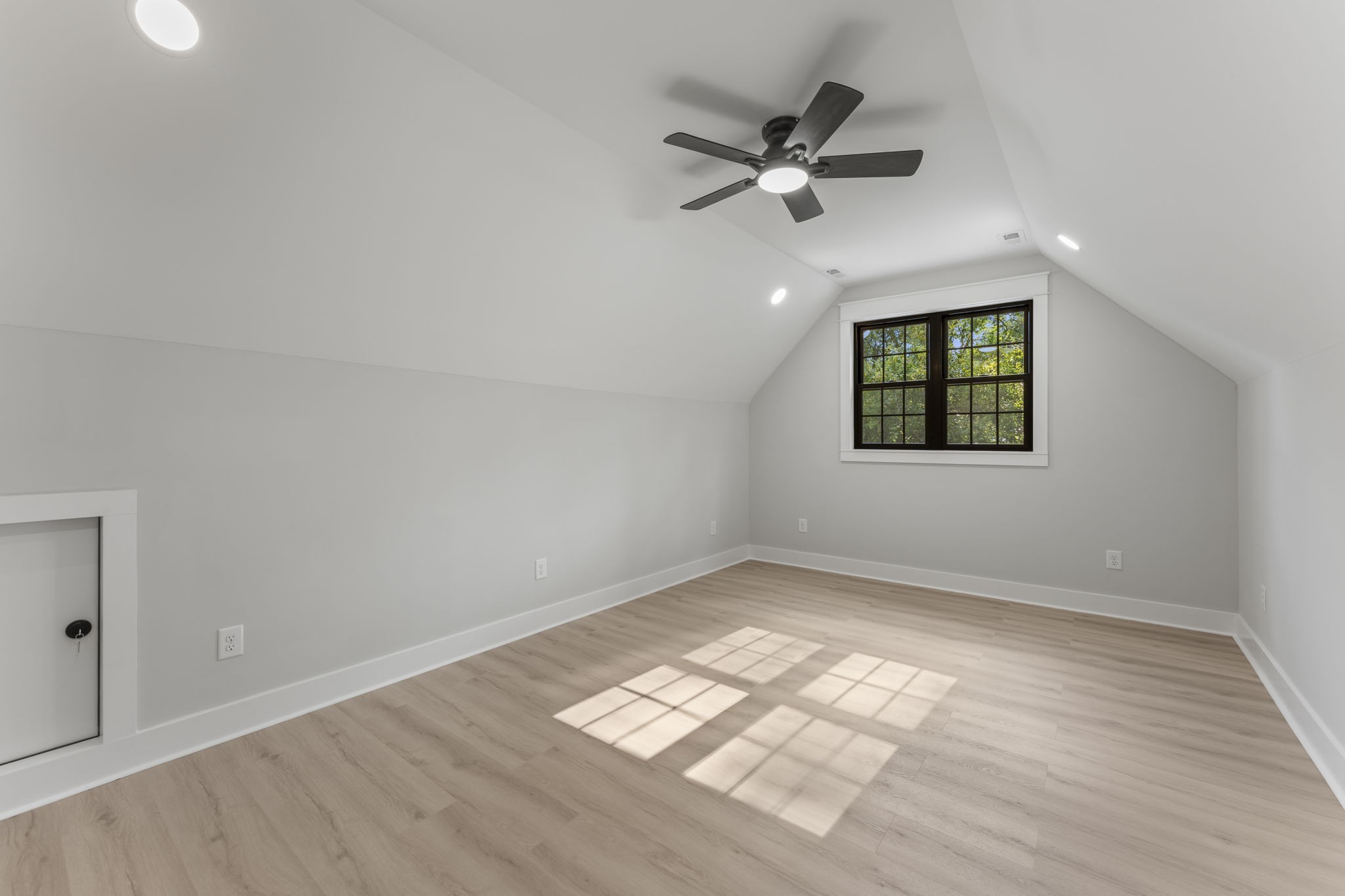 106 5th Avenue North Decherd, TN 37324 - Photo 40 of 50 wooden floor in an empty room with a window