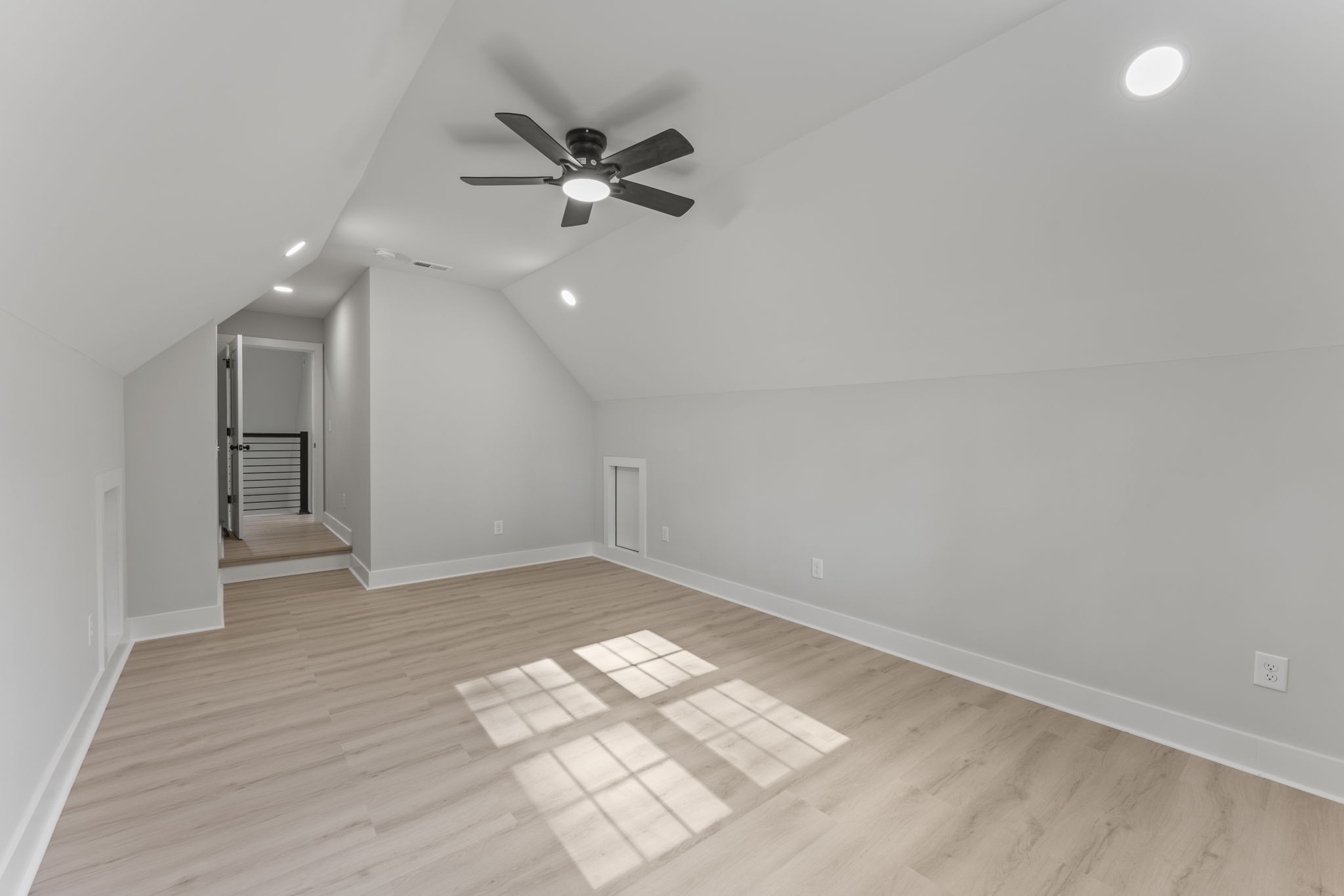106 5th Avenue North Decherd, TN 37324 - Photo 41 of 50 an empty room with wooden floor fan and windows