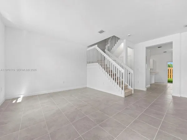 a view of a hallway with staircase