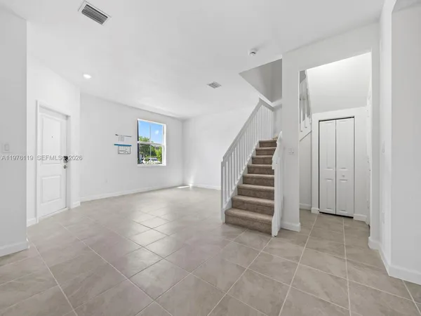 a view of an entryway with stairs