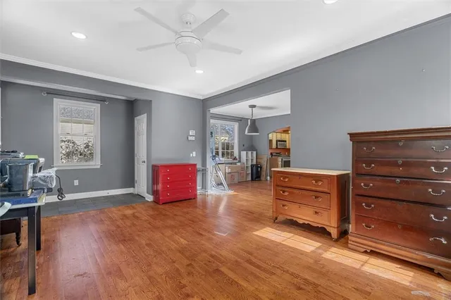 a room with furniture and wooden floor