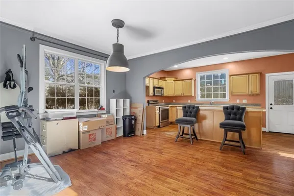 a living room with furniture and large windows
