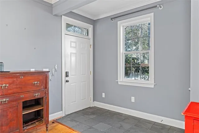 an empty room with windows and closet