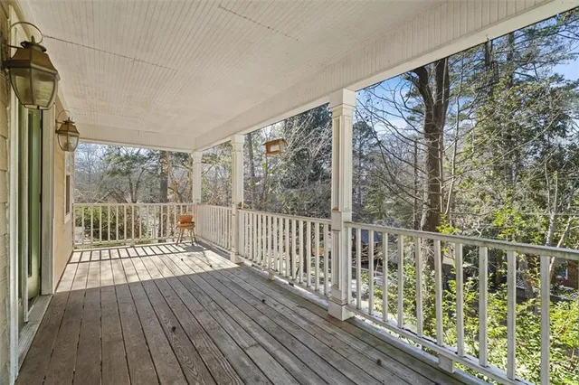 a view of balcony with wooden floor