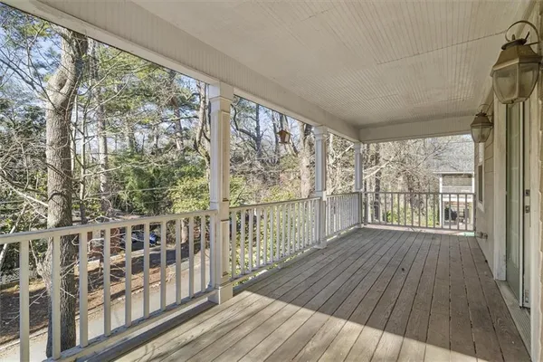 a view of a balcony with wooden floor