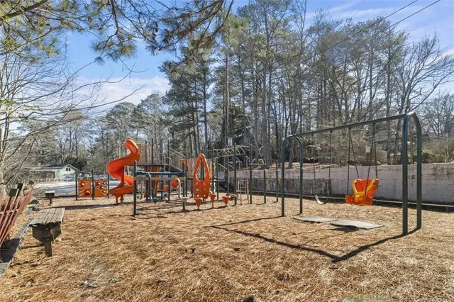 a view of a park with swings