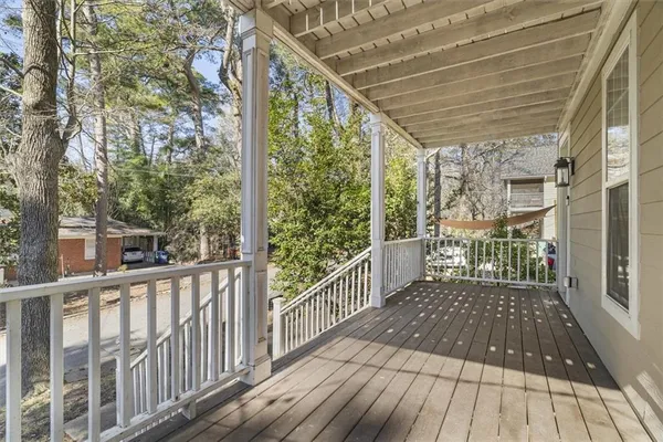 a view of a balcony with wooden floor
