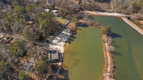a view of a lake with a yard
