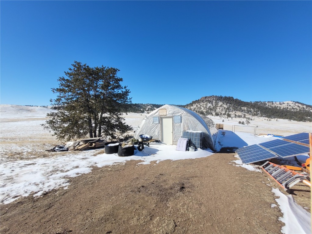 Tbd Tbd Kusha Road Hartsel, CO 80449 - Photo 5 of 14 a view of a house with a snow in the yard