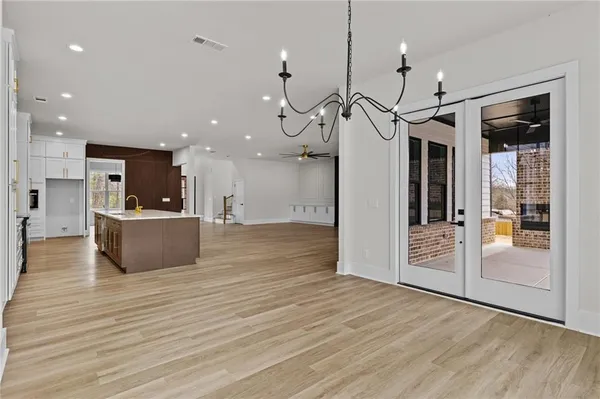 a view of a kitchen and a chandelier