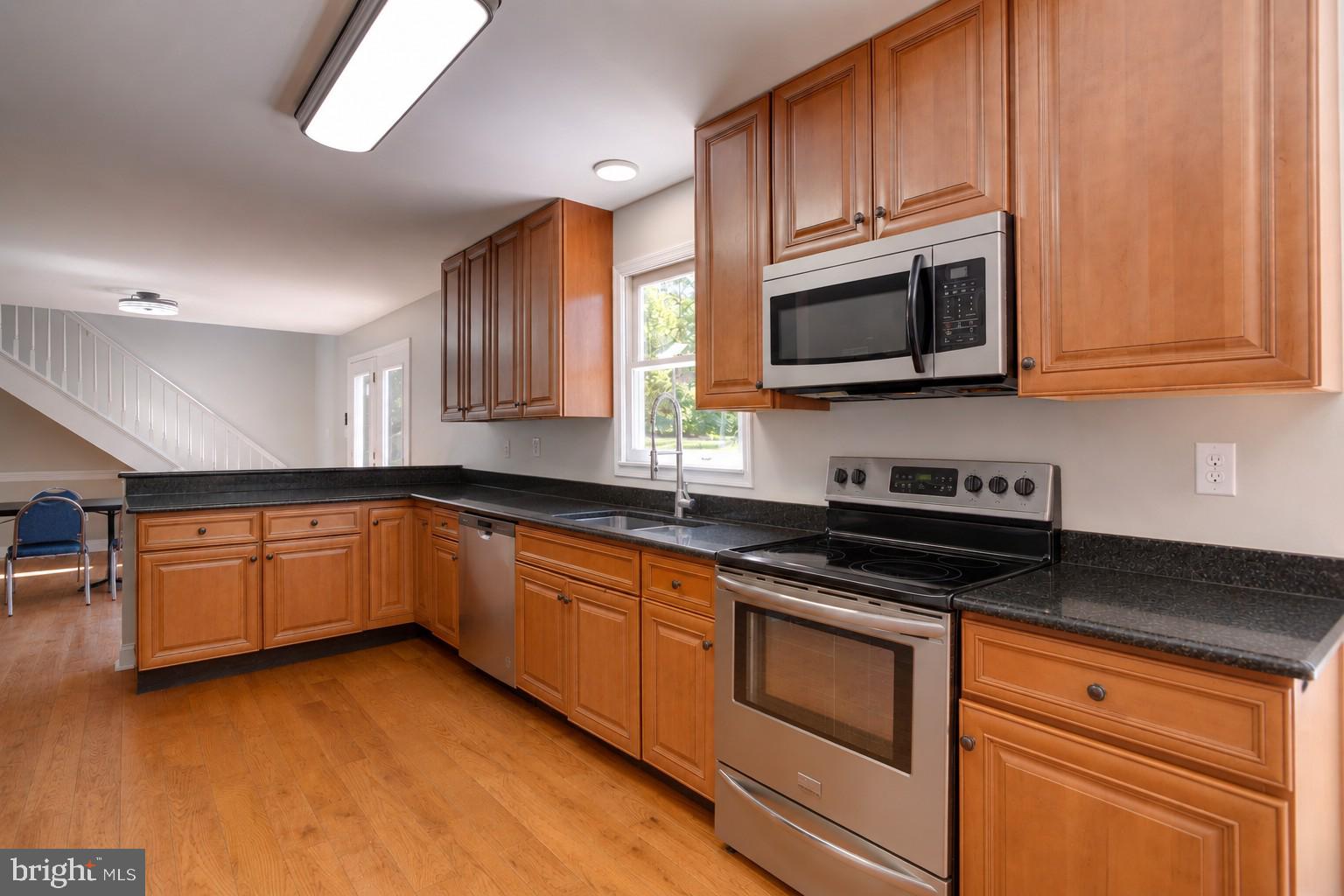 10461 Old Stillhouse Road Boston, VA 22713 - Photo 5 of 63 Modern kitchen with warm wood tones.