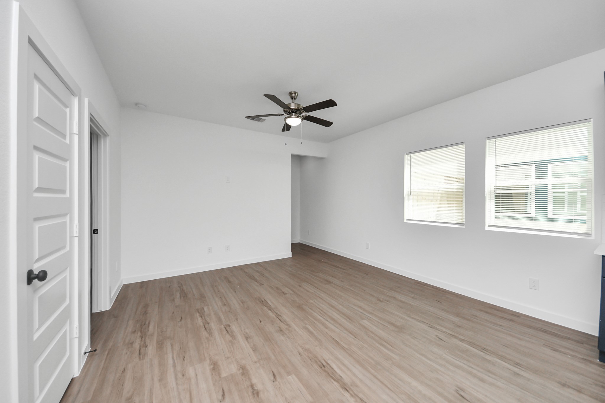 7312 Wileyvale Road, Unit C Houston, TX 77016 - Photo 18 of 39 wooden floor in an empty room with a window